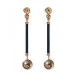 Pair of earrings in 18kt yellow gold, diamonds and onyx. Long earrings with movement, model of three