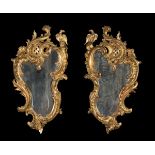 Pair of Rococo cornucopias; Spain, early 20th century.Carved and gilded wood.Measurements: 72 x 39