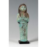 Ushebti of the Egyptian nobleman, Mayor Pay, New Empire, 1526-1070 BC.Blue-greenish faience.