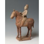 Horse with rider. China, Tang Dynasty, AD 619-906.Polychrome terracotta.Provenance: Private