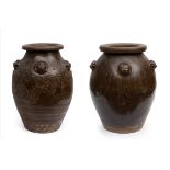 Pair of Martaban vessels; China, 20th century.Earthenware.One of the vases has imperfections in