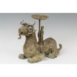 Ancient Lion Foo; after Han dynasty models; 20th century.Bronze.Measurements: 39 x 53 x 24.Bronze