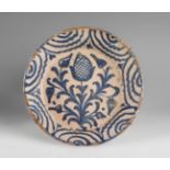 Dish from the Opium Poppy Series. Talavera de la Reina, 18th century.Glazed ceramic.Measurements: 25