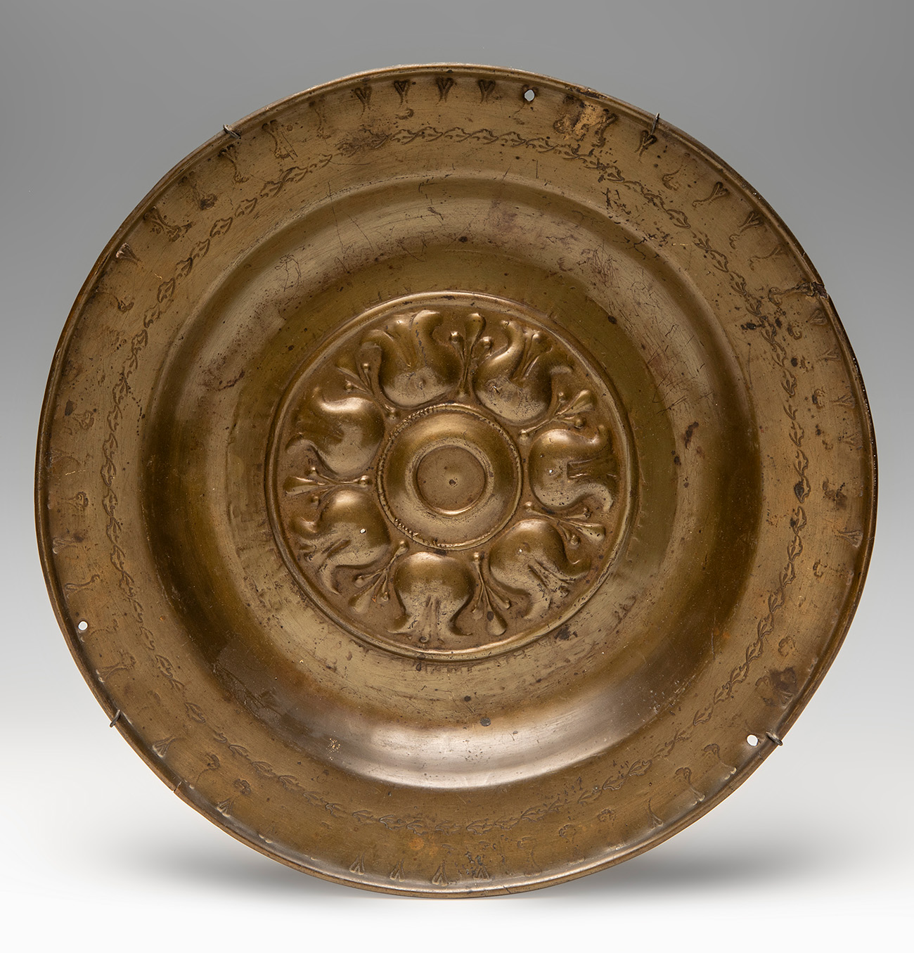 Petition plate. Germany, possibly Nuremberg, 16th century.Gilded copper.Measurements: 37.5 cm (