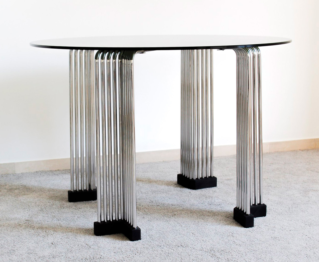 Coffee or living room table, Italian manufacture, 1970s.Chromed metal structure and smoked glass.The