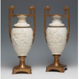 Pair of vases. France, 19th century.Biscuit and bronze.Measurements: 45 cm. high.Pair of vases in