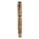 MONTEGRAPPA FOUNTAIN PEN, "AZTEC".Body in solid bronze with gold finish.Nib in 18 Kts. gold. F-