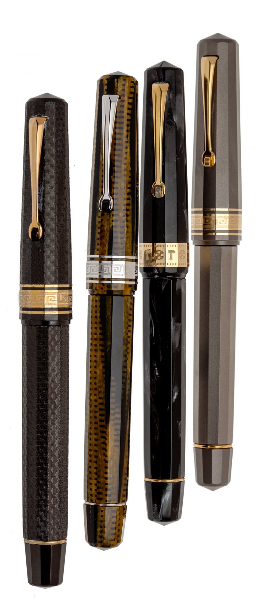 OMAS PARAGON FOUNTAIN PENS.Bodies in resin, metal and different lacquers.Nibs in 18 Kts gold, two
