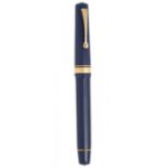 OMAS PARAGON FOUNTAIN PEN "LISBON EXPO98".Barrel in blue cotton resin.Two-tone 18 Kts gold nib, F-