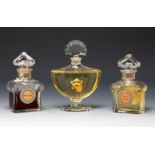 Baccarat for GUERLAIN. France, ca. 1920-30.Three Guerlain fragrance perfume bottles.Moulded glass.