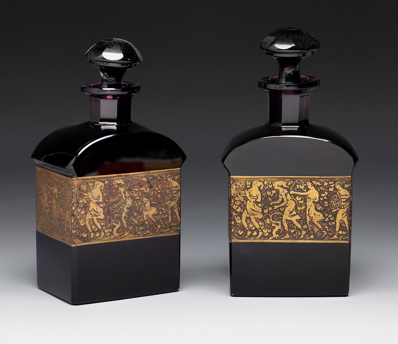 MOSER. Czechoslovakia, ca. 1910.Pair of perfume bottles.Moulded glass.Signed on the reverse of the