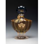 "Shalymar", perfume by GUERLAIN. France, ca. 1980.Glass and lithographed cardboard.Provenance: