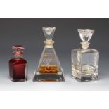 Three Art Deco perfume bottles. France ca. 1940. Moulded glass.Provenance: Spanish private