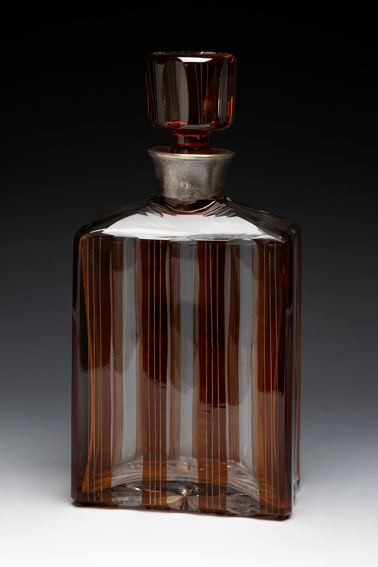 Art Deco decanter. Bohemia, ca. 1930.Bohemian glass. Silver mouthpiece.With contrasts on the rim.