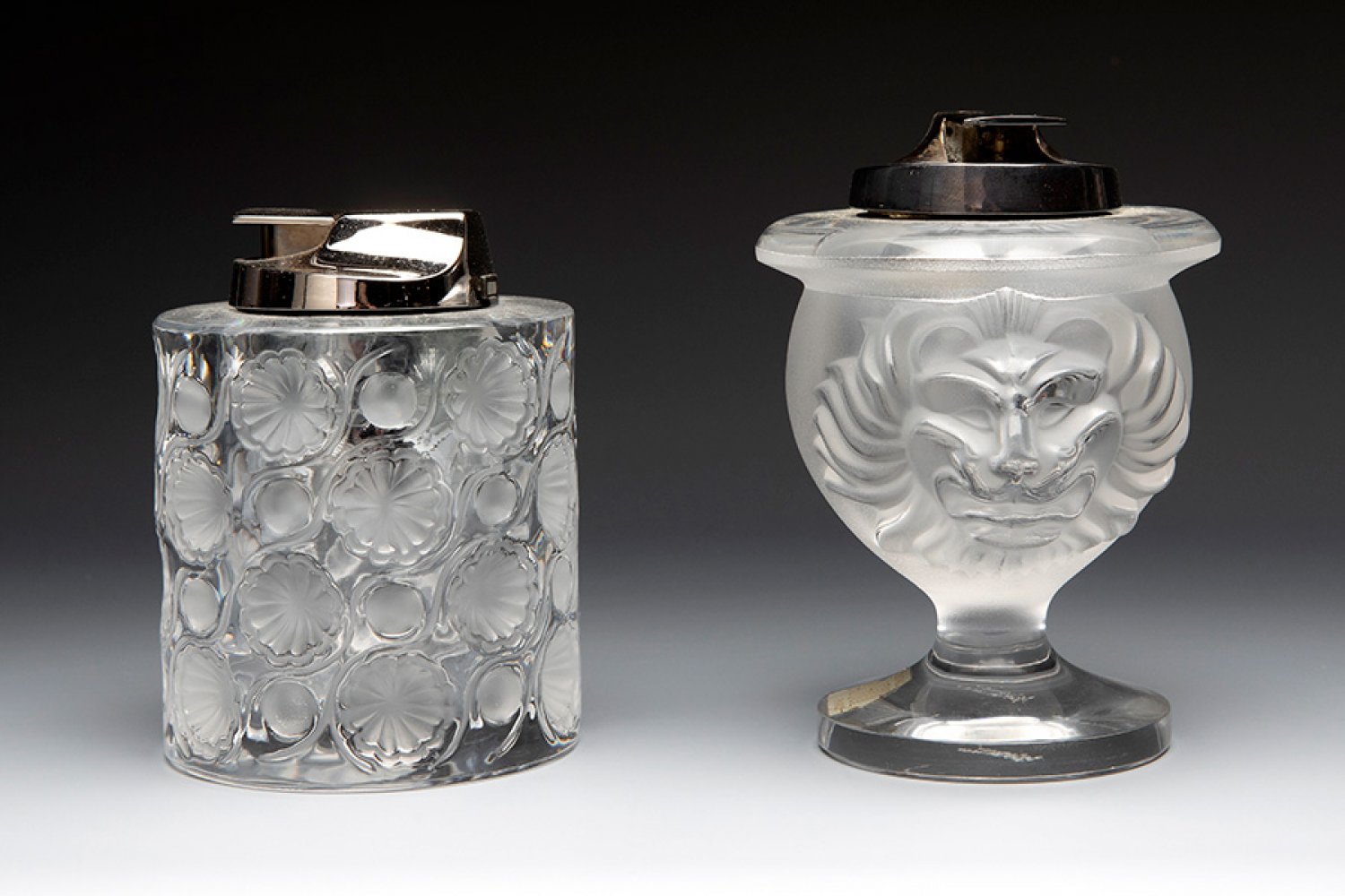 Marc LALIQUE (Paris, France, 1900 - 1977).Two lighters "Tokyo" and "Lion's head". France, ca. 1950.