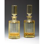 Pair of Art Deco perfumers. Bohemia, ca. 1930.Moulded and faceted glass.Provenance: Spanish