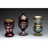 BOHEMIA. Czechoslovakia, second half of the 20th century.Two vases and a bonbonniere.In cut glass.