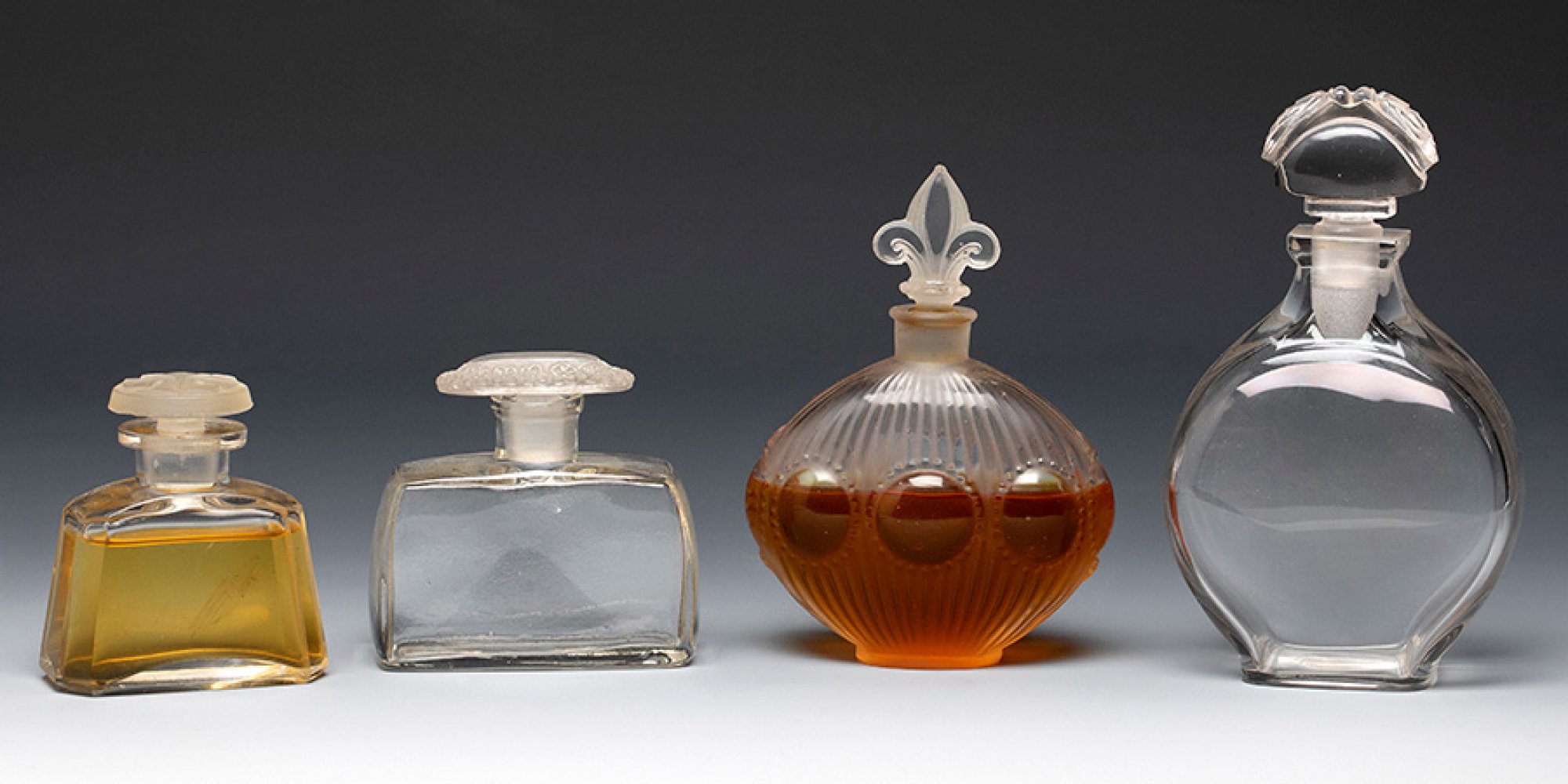 Four Art Deco perfume bottles. France ca. 1940. Moulded glass.Provenance: Spanish private