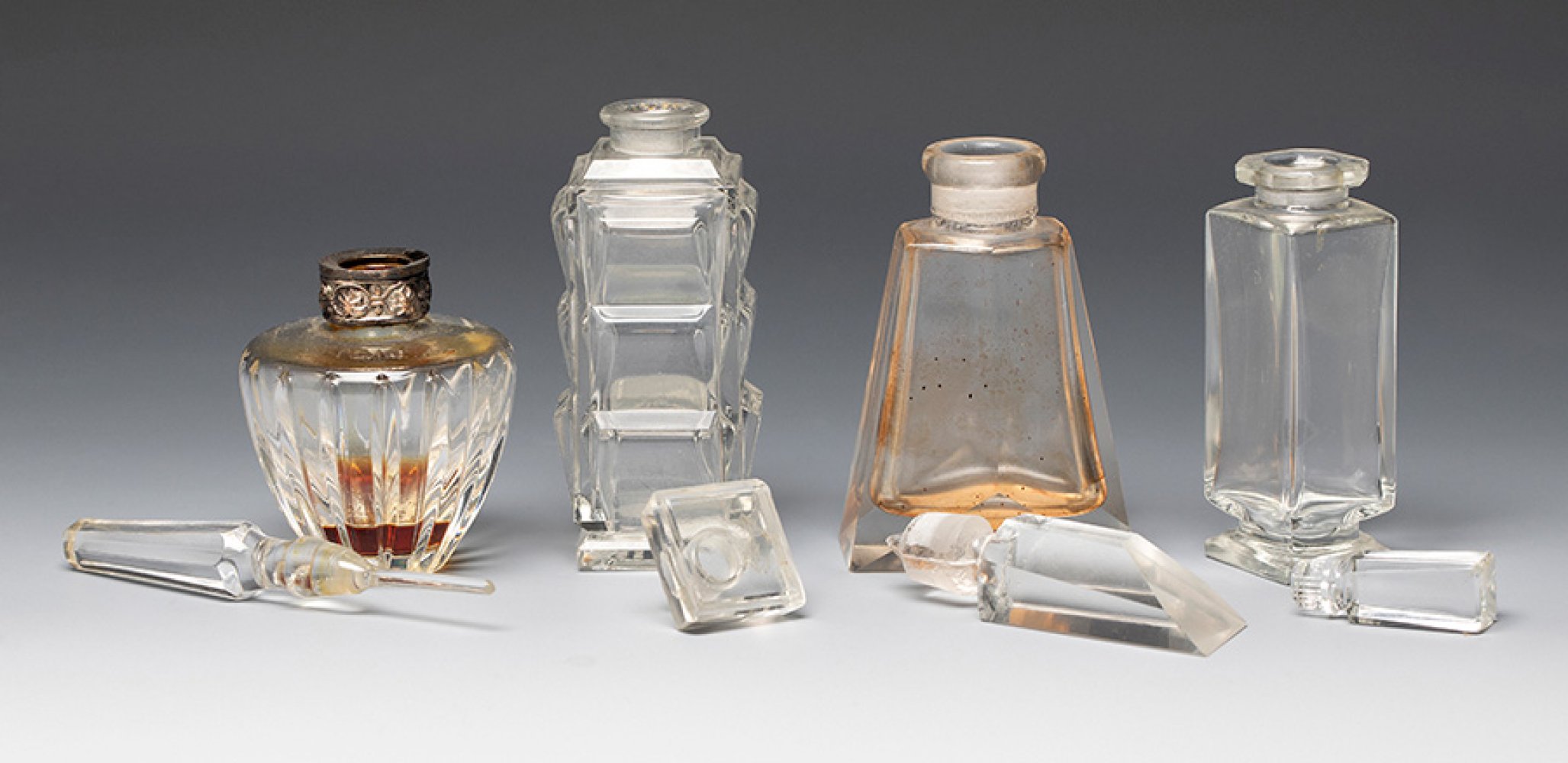 Four Art Deco perfume bottles. France ca. 1940. Moulded glass.Provenance: Spanish private - Image 2 of 4