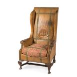 Baroque style armchair, 19th century.Upholstered in leather and decorated with fabric borders.Fabric