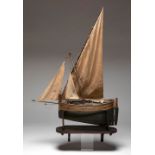 Model ship, 19th century.Painted wood and fabric.On wooden base.Measurements: 98 x 73 x 24 cm.;