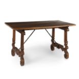 Baroque dining table, ca. 1700.Walnut wood. Iron fasteners.It has xylophages. Needs refinishing.