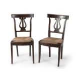 Pair of Fernandina chairs, first third of the 19th century.Walnut wood structure and bulrush seats.