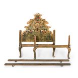 Olotine single bed, 18th century.Carved, polychromed and gilded wood.The polychromy is missing.The