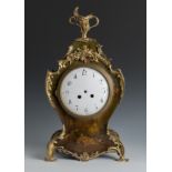 Rococo style clock. France, 19th century.Polychrome wood and bronze ornaments.The machinery needs to