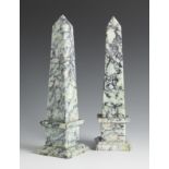 Pair of hard stone obelisks. First half of the 20th century.Hard stone, greyish colour and black