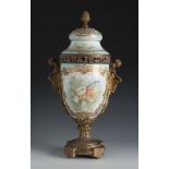 Sèvres vase. France, 18th century.Hand-painted porcelain and gilt bronze mount.With stamp on the