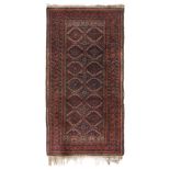 Baluch carpet. Pakistan, 19th century.Hand-knotted wool.Fringe losses. Wear due to use and the