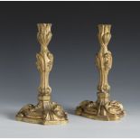 Pair of Louis XV style candlesticks. France, ca. 1870.Gilded bronze.Measurements: 24 x 14 x 14 cm.