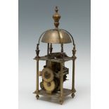 Lantern clock, after 16th century models; 19th century.Bronze.It has a handle and weight.Needs