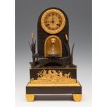 French table clock. Charles X, ca.1830.With automaton (fountain).Mercury gilt and blued bronze