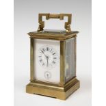 Travel clock; late 19th century.Bronze and bevelled.No key preserved.Measurements: 17 x 10 x 9 cm.