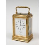 Travel clock; "R.Garin. Madrid, 19th century.Bronze and bevelled glass.Preserves key.Measurements: