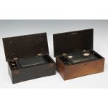 Pair of musical boxes, XIX century.Wood, brass, iron and gilt bronze.In need of restoration and fine