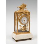 Louis XVI style clock, late 19th century.Gilt bronze, rhinestones and marble.The marble is missing.
