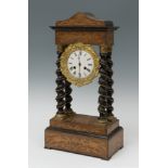 Portico clock; Napoleon III, late 19th century.Ebonised wood and marquetry.In need of repair and