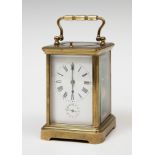 Travel clock; late 19th century.Bronze and bevelled glass.No key preserved.Measurements: 13 x 8.5