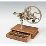 Arrondir machine; late 19th century.Mounted on a drawer with working tools.Damaged.Measurements: