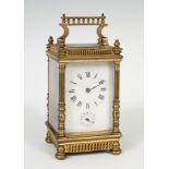 Travel clock from the second half of the 19th century.Gilt bronze and bevelled glass.With key.