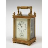 L & E Fabre" travel clock, late 19th century.Bronze and bevelled glass.Key preserved.Measurements: