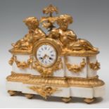 Napoleon III Clock, France, 19th century.Gilded bronze and marble.Measures: 50 x 52 x 17 cm.Table
