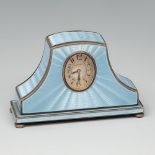 ZENITH travel clock. Ca. 1900. Partially gilt silver and blue guilloché enamel. White dial, Arabic