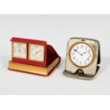 Set comprising two travel alarm clocks; 20th century.Metal and leather.In need of repair.