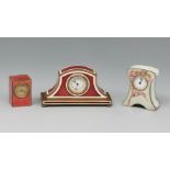 Set of three travel clocks, bronze, silver and enamel. Ca. 1900. White dials, Arabic numerals, two