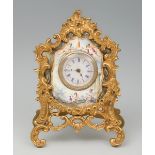 Table clock in gilt bronze. Vienna. Louis XV style. Late 19th century. Gilt bronze and enamel. White