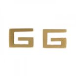 GUCCI. "G" logo.Pair of earrings in 18kt yellow gold. Snap clasp.Weight: 1.4 g.